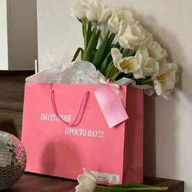 15 белых тюльпанов с стильном пакете